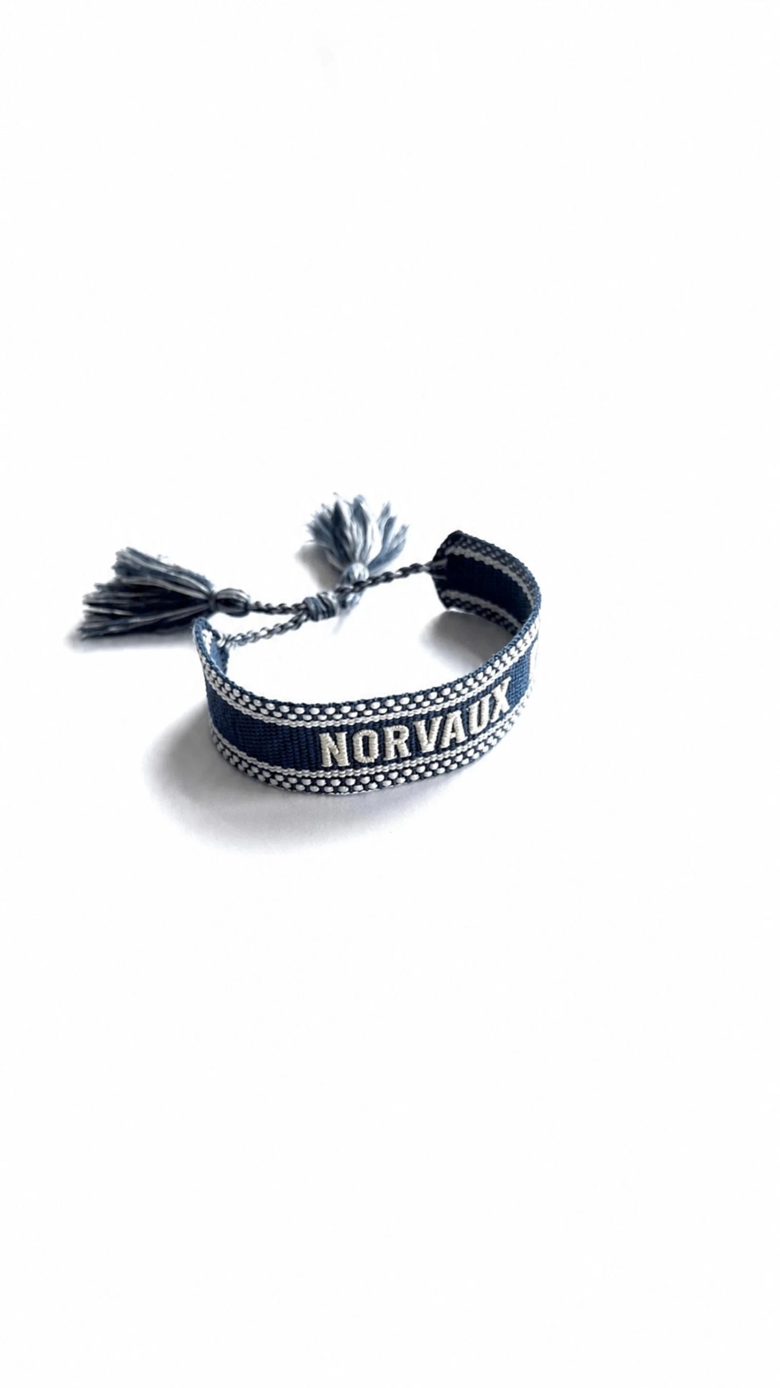 Maison Band woven bracelet, navy ground with white stitching and tassels