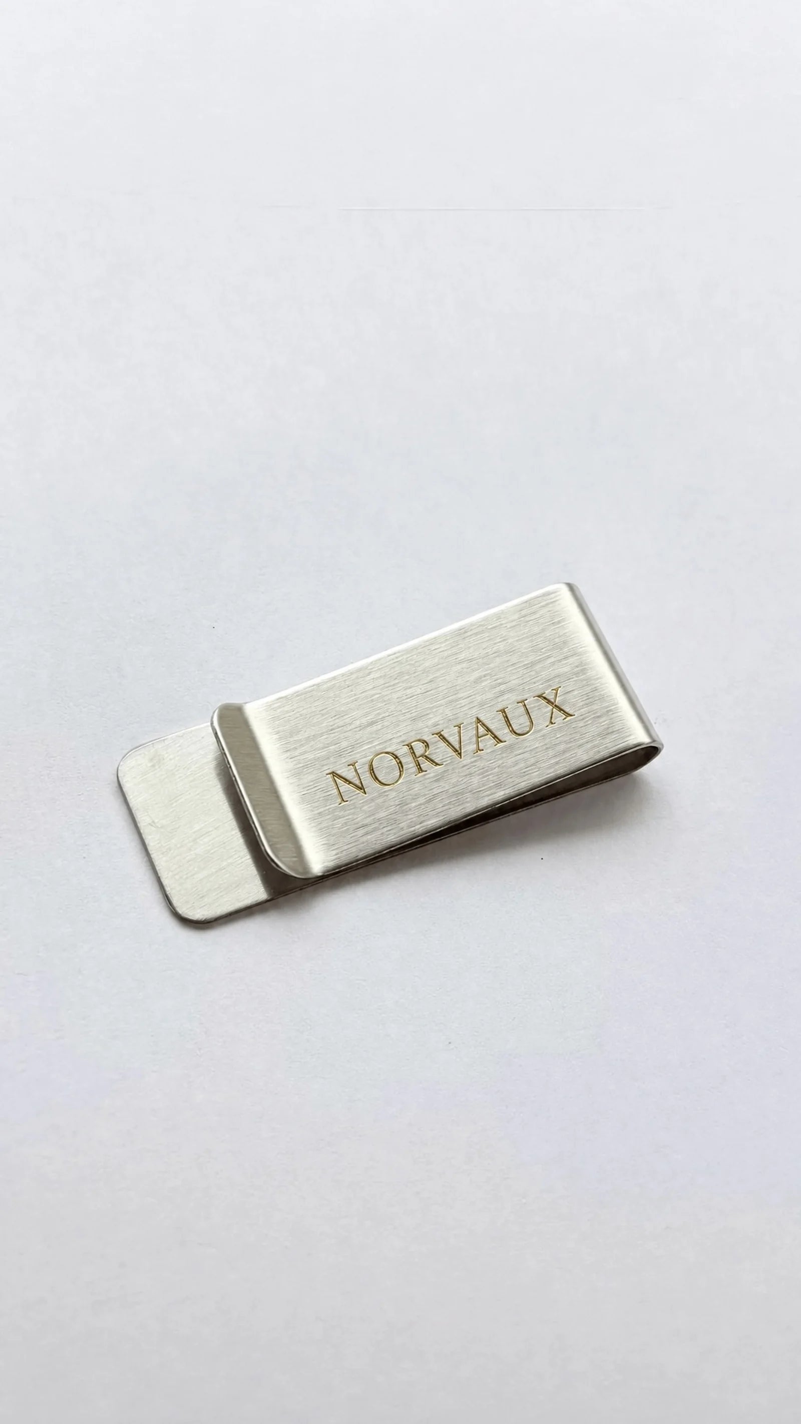Silver Clip from the side, showing the single fold of brushed metal