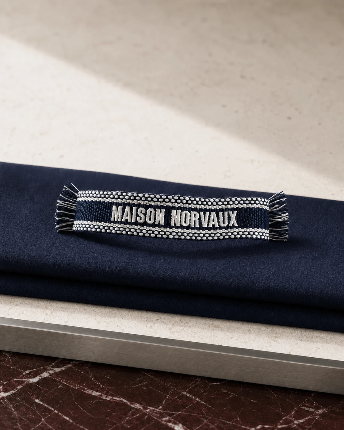 Navy Maison Band woven bracelet with white MAISON NORVAUX lettering