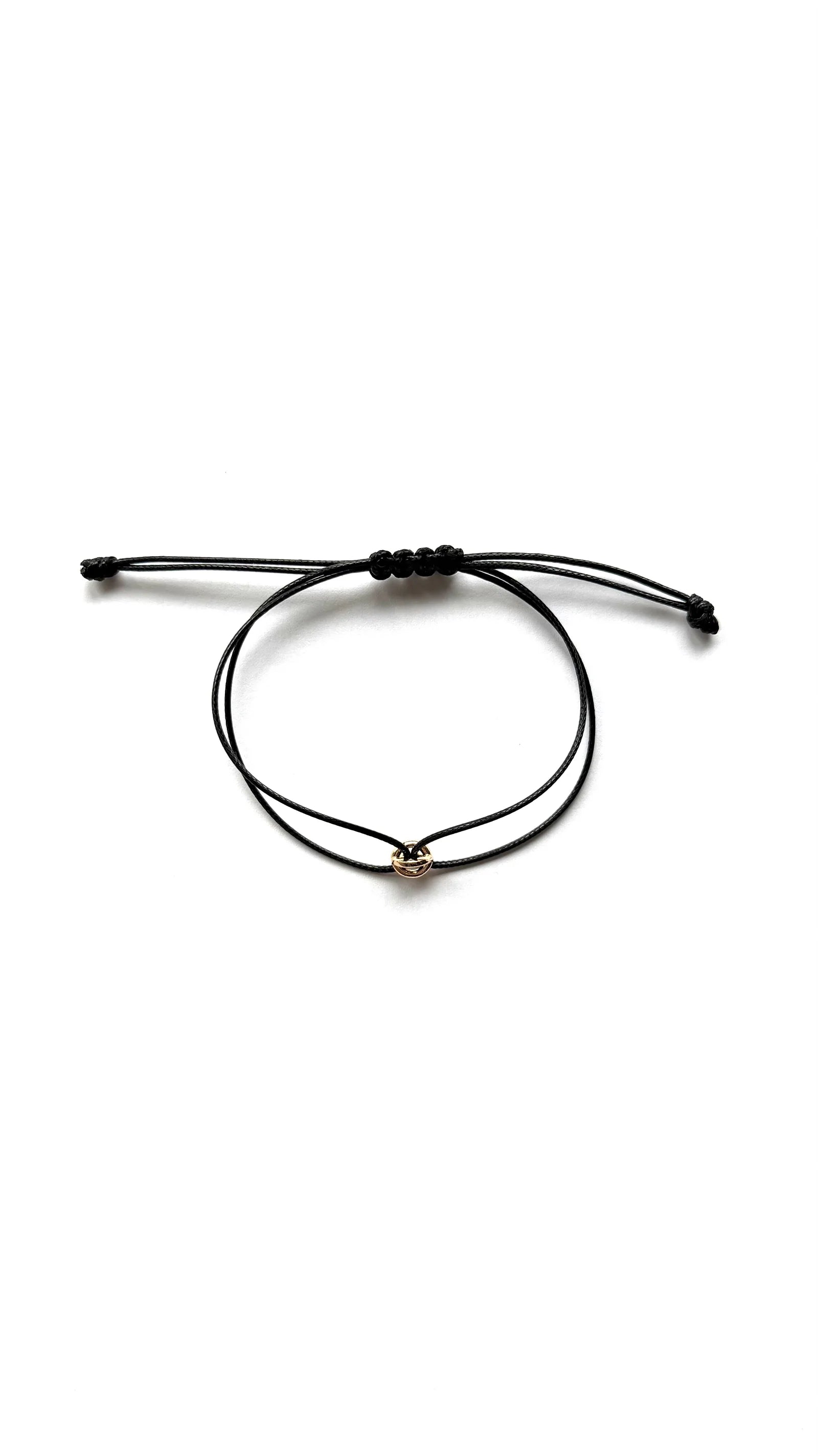 ORÉA Noir, black cord bracelet with a single gold-plated bead