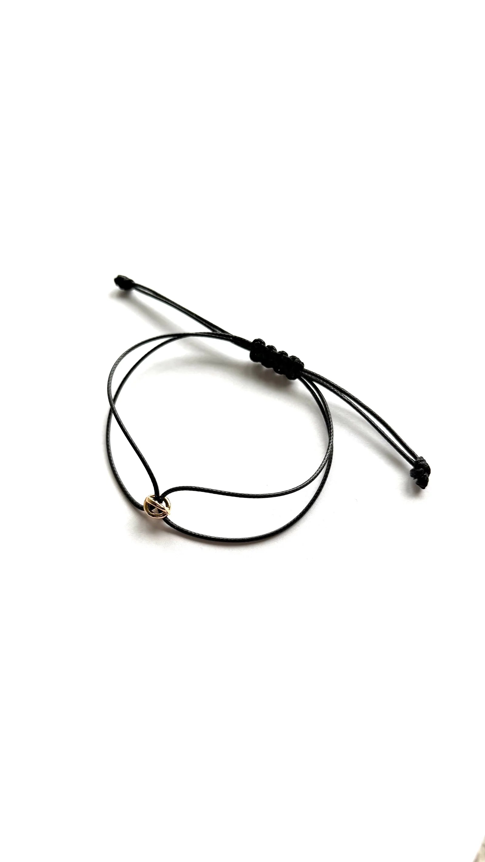 ORÉA Noir detail of the gold-plated bead on black cord