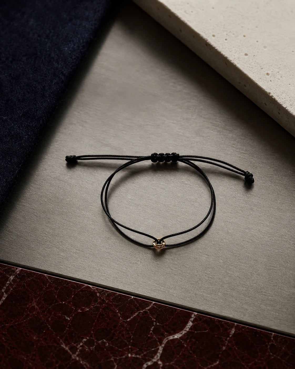 ORÉA Noir black cord bracelet with a polished gold-tone bead