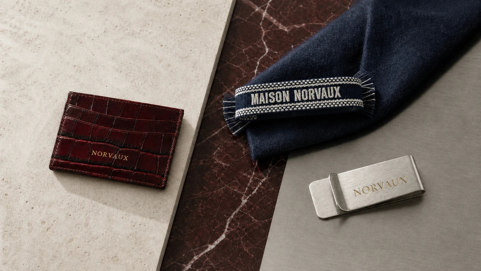 NORVAUX leather, woven textile and brushed metal objects arranged as a material study